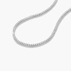 This tennis necklace is the epitome of elegance. A row of scintillating round brilliant diamonds are set on four prong baskets and lined up perfectly to create the most glamorous diamond necklace. A box clasp with security latch closes and secure the necklace in place. Tennis Necklace Layered, Diamond Tennis Necklace, Box Clasp, Tennis Necklace, Brilliant Diamond, Lab Created Diamonds, Round Brilliant, A Box, Layered Necklaces