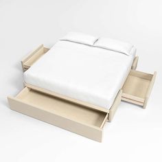 the bed is made up and ready to be placed in its storage drawer area,