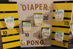 several diapers are displayed in front of a sign