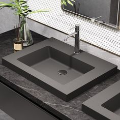 a bathroom sink sitting on top of a counter next to a vase with a plant