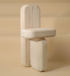 a white wooden chair sitting on top of a table