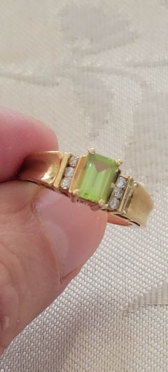 Peridot Vintage Ring, Classic Green Birthstone Ring With Accent Stones, Green Rings With Diamond Accents For Formal Occasions, Formal Green Rings With Diamond Accents, Formal Green Birthstone Ring With Accent Stones, Formal Peridot Diamond Ring With Center Stone, Formal Peridot Birthstone Ring For May, Classic Peridot Gemstone Diamond Ring, Classic Peridot Diamond Ring