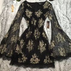 Lulus Black And Gold Lace Flounce Sleeve Dress. Sheer Long Sleeves. Lined. New With Tags Size Small Black And Gold Dress Short, Black And Gold Ball Gown, Black And Gold Outfit, Gold Dress Short, Masquerade Ball Gowns, Flounce Sleeve Dress, Gold Lace Dresses, Dresses Lulus, Gold And Black Dress