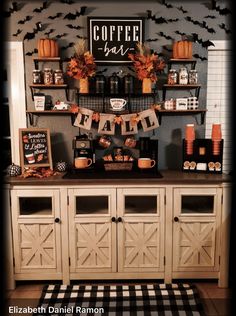 a coffee bar decorated for halloween with pumpkins and decorations