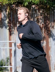 a man running with ear buds in his ears