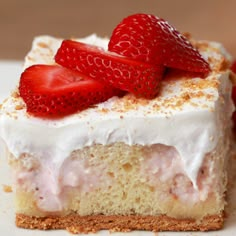 a piece of cake with whipped cream and strawberries on top