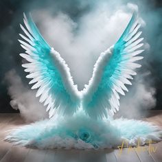 an artistic image of a blue bird with white wings