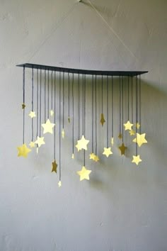 a wind chime with stars hanging from it