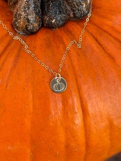 "I'm so glad I live in a world where there are Octobers." Anne of Green Gables The cutest and daintiest necklace to celebrate Fall! Gold filled, 9.25mm disc, hand stamped pumpkin necklace. Gold filled chain and jump rings. Also available in sterling silver. World Where There Are Octobers, Fall Necklace, Pumpkin Jewelry, Pumpkin Necklace, Autumn Necklace, Halloween Necklace, Jewelry Cute, Anne Of Green, Anne Of Green Gables