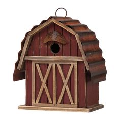 a wooden birdhouse with a brown roof