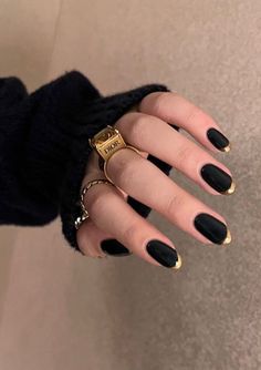 40 Trendy French Tip Nails For A Modern Twist Black Nail With Gold Tip, Black Nail Gold Tip, Black With Gold Tips Nails, Witchy French Nails, Dark Nails French, Gold Black Nails Design, Black And Bronze Nails, Black Nails Gold Tips, Simple Black And Gold Nails