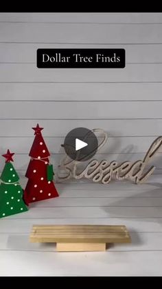 the dollar tree finds logo is displayed in front of three christmas trees and a wooden sign