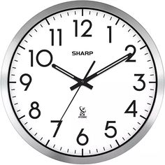 a round clock with numbers on each side and the words sharp written in black ink