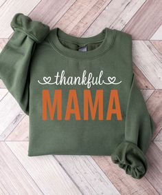 Mama and Mamas Pumpkin Fall Sweatshirts, Mommy and Me Sweaters, Mom Baby Outfit, Matching Outfits, Kids Fall Shirt, Fall Gifts, Thanksgiving We are offering UNISEX clothing options in a variety of sizes from T-Shirt and Sweatshirt styles including the Super Soft Bella Canvas 3001 T-Shirt (100% cotton) and the heavy blend crewneck sweatshirt(50% cotton/50% polyester) to baby size bodysuits which comes in a variety of different colors: ---------------------------------------- ❄︎ What size to buy ❄︎ This items runs true to size. Please refer to the size chart for measurements. ---------------------------------------- Return Policy : - All items are made-to-order. Because of the nature of these items, unless they arrive damaged or defective, we DO NOT accept returns. -------------------------- Family Letter Print Tops For Fall, Cute Green Sweatshirt With Letter Print, Fall Tops With Letter Print, Cotton Sweatshirt For Fall, Green Family Matching Tops For Gift, Green Long Sleeve Tops For Mother's Day, Mom And Baby Outfits, Thankful Mama, Outfit Matching