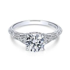 a white gold engagement ring with an intricate design