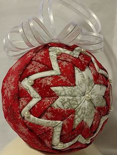 a red and white ornament on a mannequin's headdress