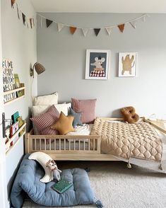 a child's bedroom with a bed and toys on the floor