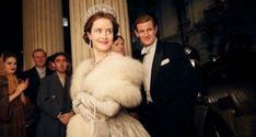 a woman wearing a tiara standing next to a man in a tuxedo