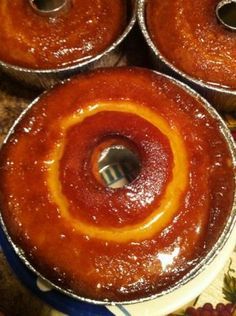 three bundt cakes sitting on top of a blue plate