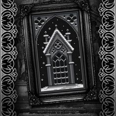 an ornate frame is shown in black and white