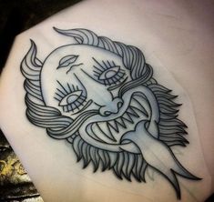 a tattoo on the back of a woman's shoulder