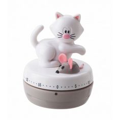 an alarm clock with a cat and mouse sitting on it's side, showing the time