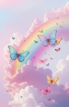 there are many butterflies flying in the sky with a rainbow behind them and some clouds