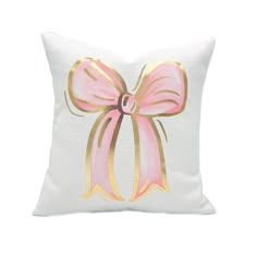 a pillow with a pink bow on it