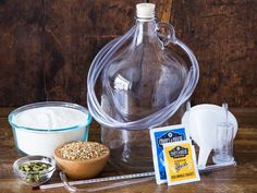 ingredients to make an oatmeal smoothie displayed on wooden table with measuring tape