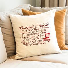 a christmas pillow on a couch with the words'christmas in heaven what do they say? '