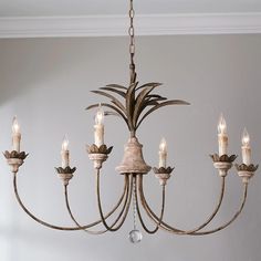 a chandelier with candles hanging from it