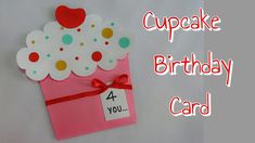 a cupcake birthday card with a red bow