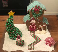 two gingerbread houses decorated to look like christmas trees