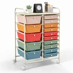 a metal cart with many drawers on it and a clock in the top right corner