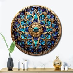 a decorative clock is on the wall next to some vases and other decor items