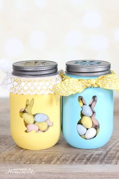 two mason jars decorated with easter decorations