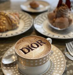 a cappuccino with the word dior written on it