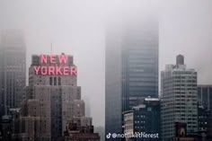 the new york city skyline is covered in fog