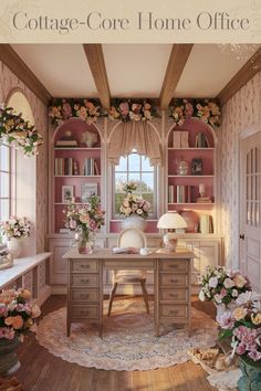 a home office decorated in pink and white with flowers on the desk, bookshelves