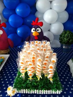 a table topped with lots of cake covered in icing