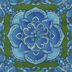 a blue and green floral design on wood