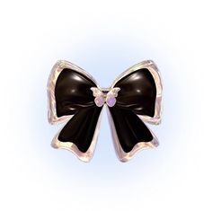 a black and white bow brooch sitting on top of a blue background with an iridescent center