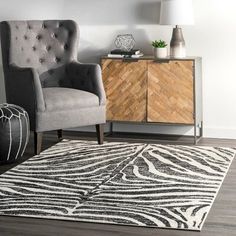 Take a walk on the wild side with this zebra print area rug. Prized for their durability and ease of care, synthetic rugs are the perfect choice when spills and constant foot traffic are at the top of your mind. Add this fun animal print pattern to any existing modern or bohemian decor and have this be the centerpiece of any room. Never settle for anything less than perfection with our easy-to-care-for and pet-friendly area rugs. | World Menagerie Skellytown Animal Print Black Area Rug Black 96. Zebra Hide, Zebra Rug, Synthetic Rugs, Zebra Stripes, Rugs Usa, Black Area Rugs, Striped Rug, Black Rug, Lake Life