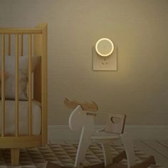 a baby's room with a rocking horse and crib in the foreground