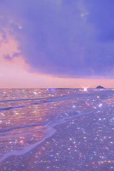 the sky is filled with stars on the beach