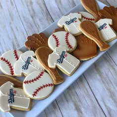 baseball themed cookies are arranged on a plate