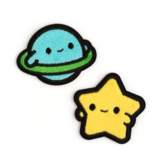 two patches with different designs on them, one has an alien and the other has a star