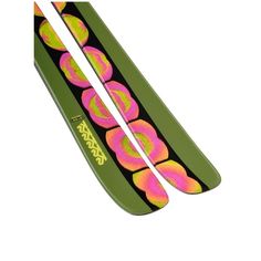 two skis with pink and green designs on them