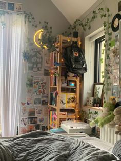 a bed room with a neatly made bed and lots of books on the shelves next to it