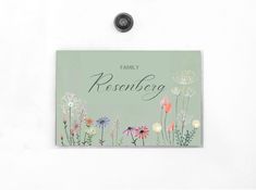 a family reunion card with flowers on the front, and an image of dandelions in the back